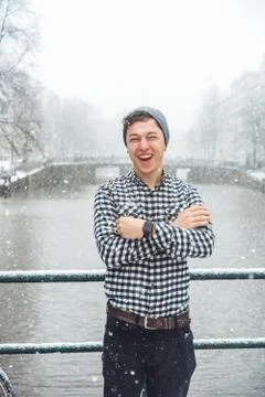 Guy is standing on a bridge Stock Photos