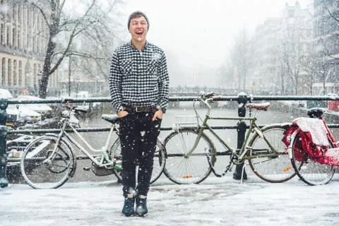 Guy is standing on a bridge Stock Photos