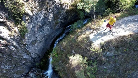 The guy is standing on the edge of the hill. Stock Footage 160682042