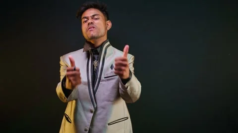 Guy standing showing thumbs up feeling victorious Stock Footage 302638768