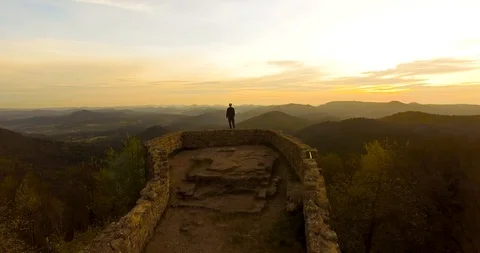 Guy standing on top of a mountain Stock Footage 91817170