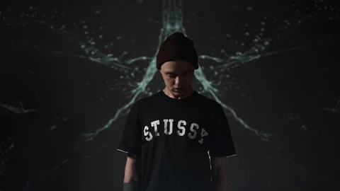 Guy stands and silently looks into the camera Stock Footage