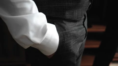 The guy stands with his hand in his pants pocket. Close-up. Stock Footage 138115300
