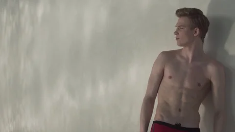 Guy stands by the pool Stock Footage 127181320