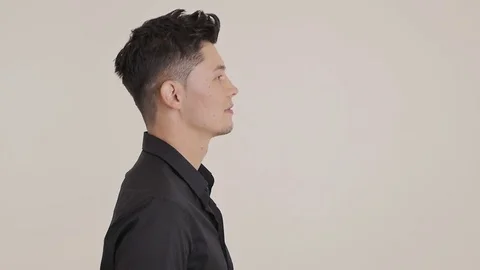 Guy Stands Sideways Video stock 87975498