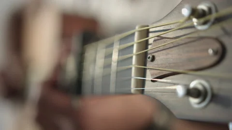 Guy starting to play guitar Stock Footage 68651721