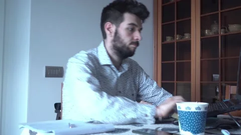 Guy starting to work in his living room with remote tools Stock Footage 132214270