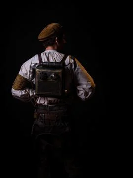 A guy in a steampunk image, a pilot or a mechanic. Retro style, fantastic image. Stock Photos