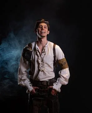 A guy in a steampunk image, a pilot or a mechanic. Retro style, fantastic image. Stock Photos