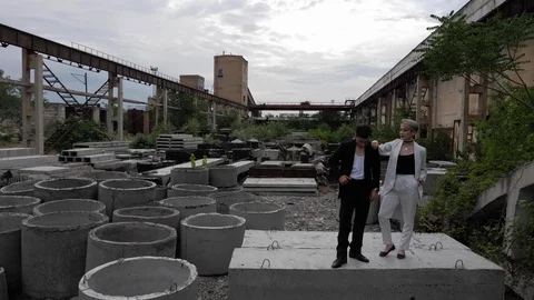 Guy straightens jacket and lady puts hand on man shoulder Stock Footage 115254310