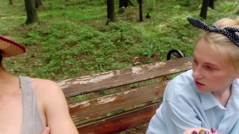 The guy in the straw hat rolls his eyes disgruntledly and turns away Stock Footage 197480486