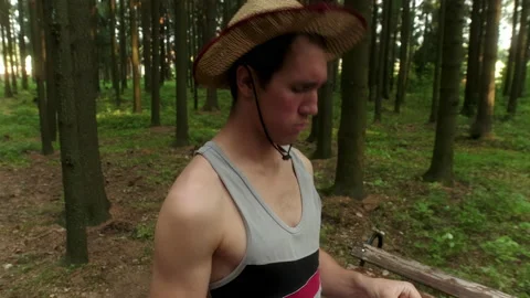 Guy in a straw hat says goodbye to a girl in a blue shirt Stock Footage 197480795