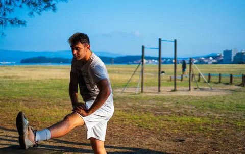Guy stretching after jogging Stock Photos