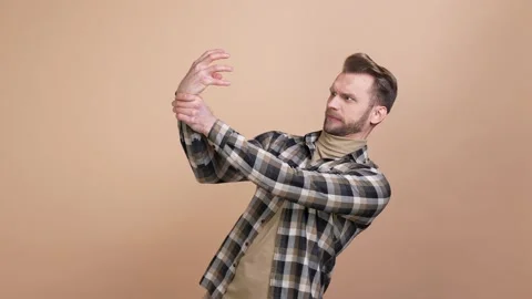Guy struggle compete with his alive arm isolated pastel color background Stock Footage 176804593