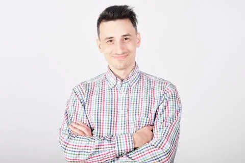 Guy student on white background smiling and looking at camera Stock Photos