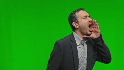Guy, student, worker employee screams mouth wide open and putting his hands to Stock Footage 169445327