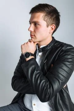 The guy in the Studio. The guy in the black jacket. Handsome guy Stock Photos