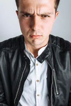 The guy in the Studio. The guy in the black jacket. Handsome guy Stock Photos