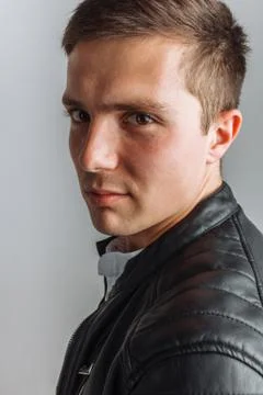 The guy in the Studio. The guy in the black jacket. Handsome guy Stock Photos