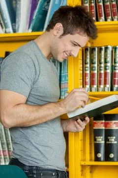 Guy studying with a book 스톡 사진