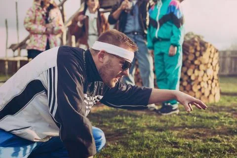 Guy in the style of the 90s playing the game Stock Photos