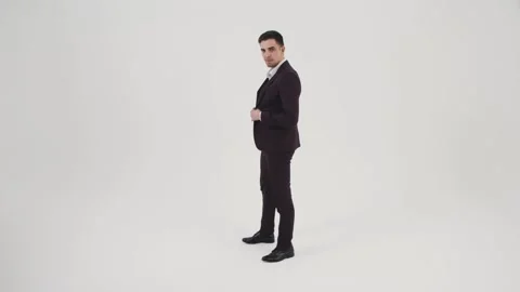 Guy in a Suit Posing for the Camera Stock Footage 144636685