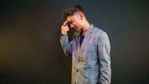 Guy in suit remembering something funny Stock Footage 302636075