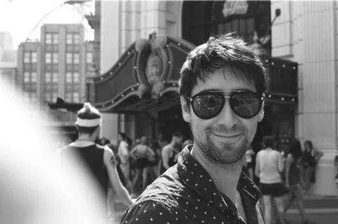 Guy with Sunglasses Smiles to Camera Stock Photos