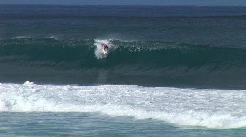 Guy surfs an awesome wave Stock Footage 323445