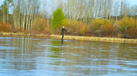 Guy surfs on river in slow motion Stock Footage 64362972