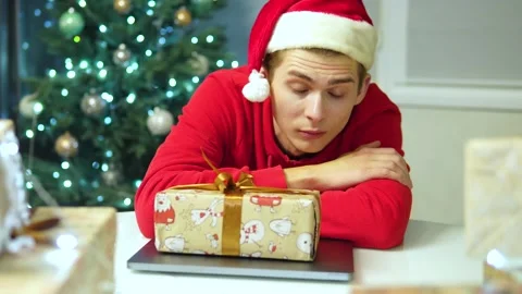 Guy is surprised that he is given a gift.businessman in red hat fell asleep 스톡 동영상 164385339