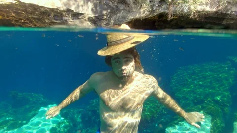 Guy Swimming in a Cenotes in Tulum | Stock Video | Pond5