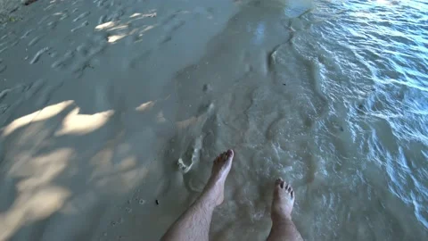 A guy swings on a swing on the beach. Video stock 190096163