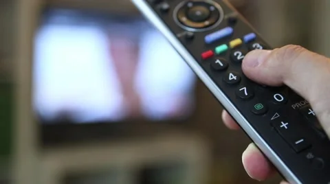 Guy switching through the TV program Stock-Footage 67619678