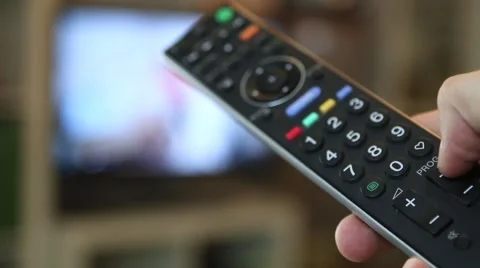 Guy switching through the TV program Stock-Footage 67619963