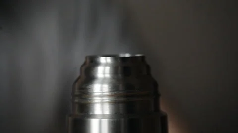 The guy at the table close the lid thermos Stock Footage 48935929