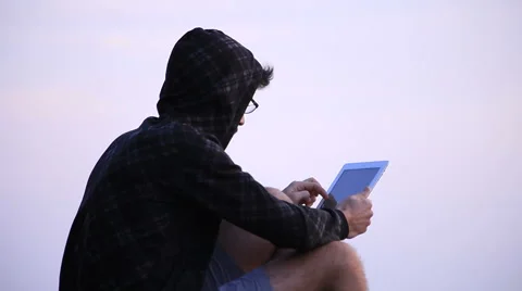 A guy with a tablet 動画素材 58116372