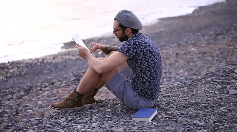 A guy with a tablet  動画素材 58263912