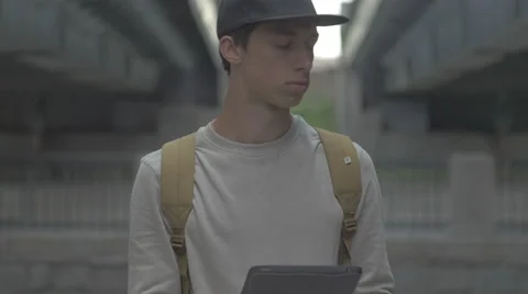 The guy with the tablet, the phone in the city, UHD Stock Footage 65367625