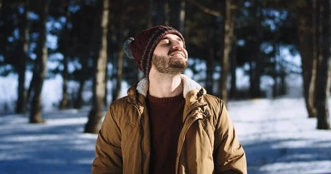 Guy take some fresh air in front of the camera in the forest winter time he Stock-Footage 112618717