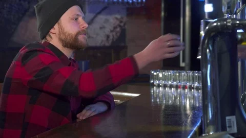 Guy takes beer at the pub Video stock 73716451