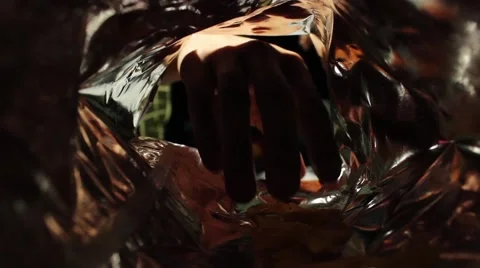 Guy takes chips from the pack Stock Footage 58146806