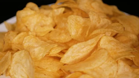 Guy takes potato chips with his hand. Close-up. Stock Footage 306491840