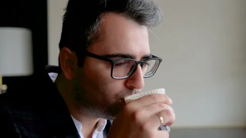 The guy takes a SIP coffee from his Cup. Slow motion Stock-Footage 142510071