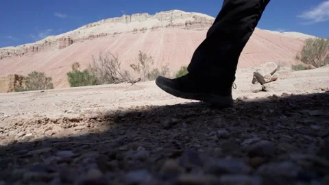 The guy takes a step across the chalk mountains Stock Footage 295786305