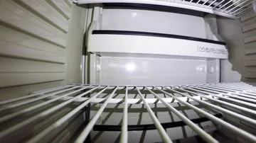 Guy taking out bananas from the fridge Stock Footage 85923588