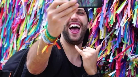 Guy taking a selfie at the Bonfim Church in Salvador, Bahia in Brazil Stock Footage