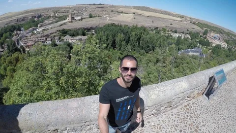 Guy Taking a Selfie in Segovia, Spain Stock Footage 79467396