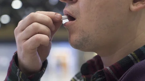 The guy is taking a virus pill Stock Footage 127457955