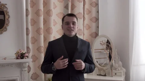 The guy is talking to the camera. In a classic suit. Stock Footage 130222632